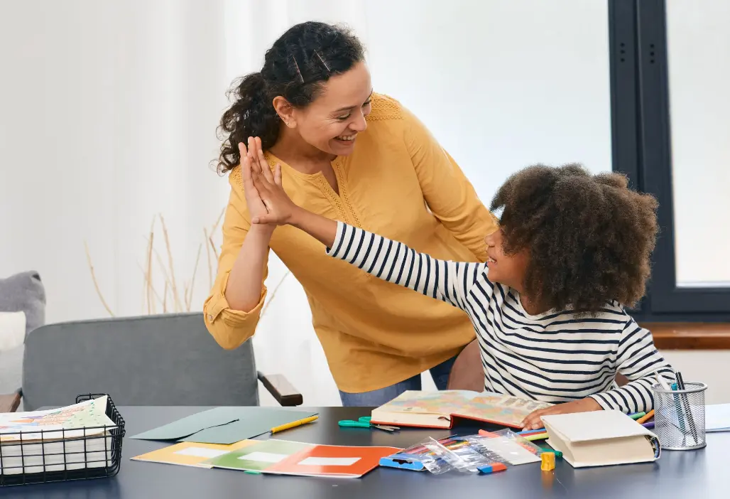 teacher and student high five